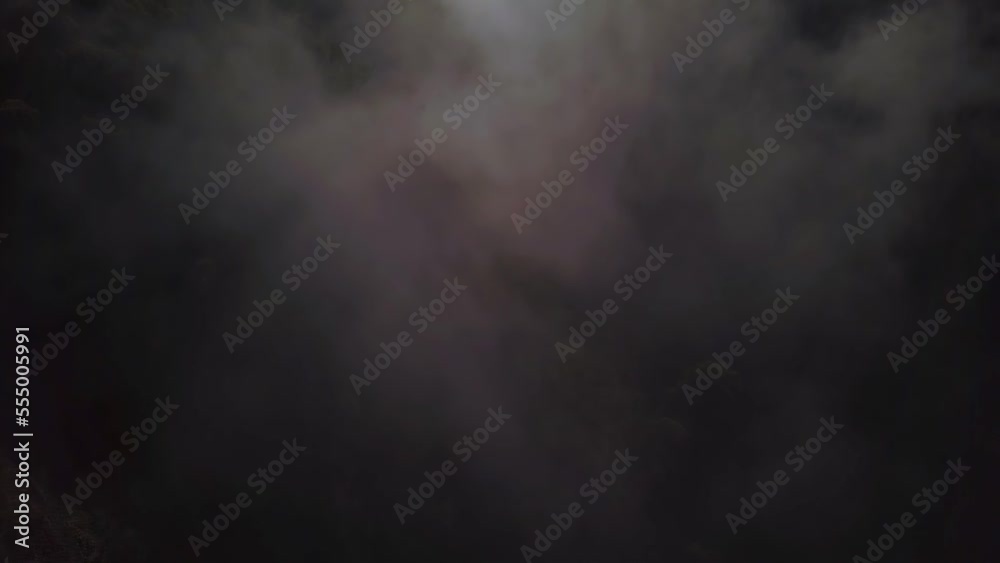 Panning shot of mists around mountains Panning shot of mists around mountains