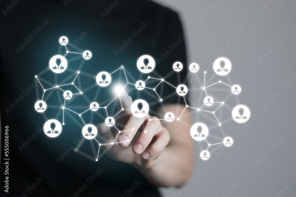 Human resources manager pointing at virtual network chain with person icons. Human capital and teambuilding concept. Human resources manager pointing at virtual network chain with person icons. Human capital and teambuilding concept.