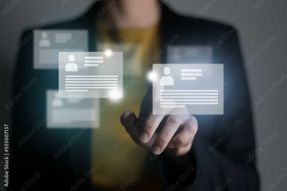 Manager looking at many different cv resume cards with candidates information. Human resources concept.Illustrative material for articles and web. Manager looking at many different cv resume cards with candidates information. Human resources concept.Illustrative material for articles and web.