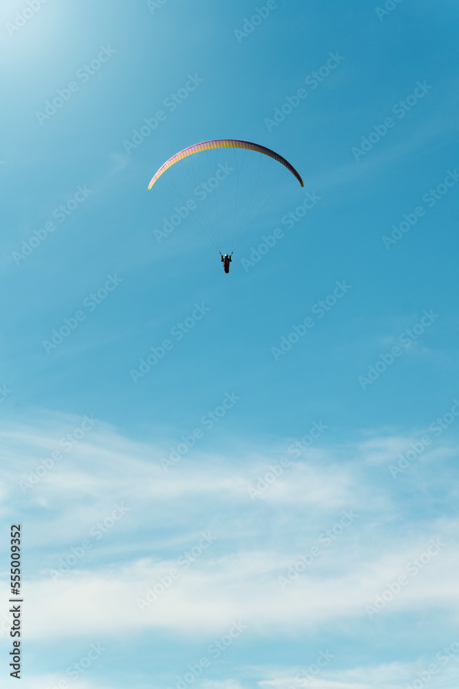 Epic paragliding flight on a beautiful sunny day. Copy space below Epic paragliding flight on a beautiful sunny day. Copy space below