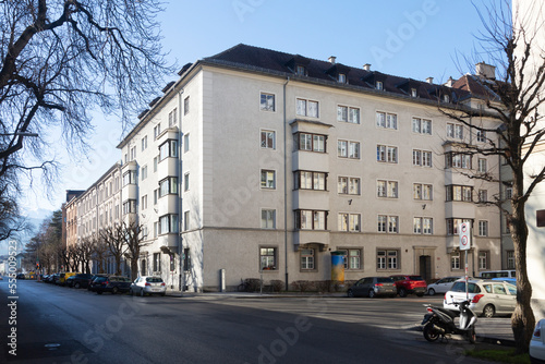 Large residential building and street with cars in Innsbruck, Tyrol