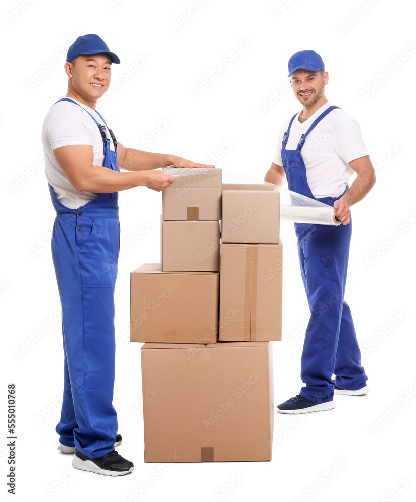 Workers wrapping boxes in stretch film on white background Workers wrapping boxes in stretch film on white background