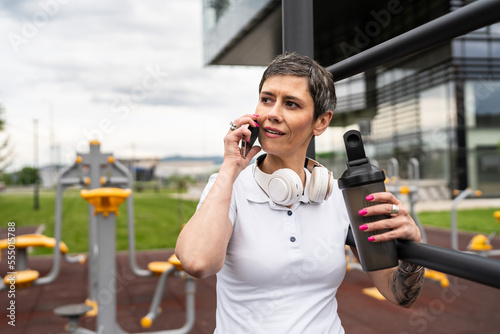 mature caucasian senior woman take a brake during outdoor training