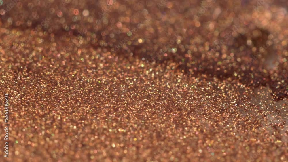 Beautiful shinny copper liquid glittery ink texture. Magic bokeh. Brilliant abstract background macro. Motion mixed glistening colorful ink Beautiful shinny copper liquid glittery ink texture. Magic bokeh. Brilliant abstract background macro. Motion mixed glistening colorful ink