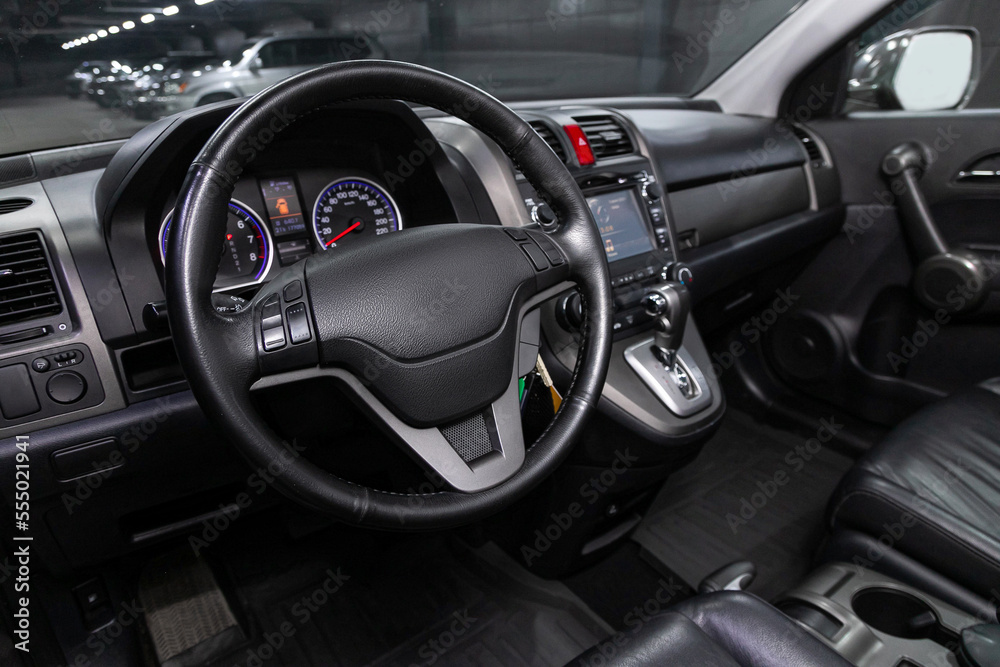car Interior - steering wheel, shift lever and dashboard, climate control, speedometer, display  on white isolated background.