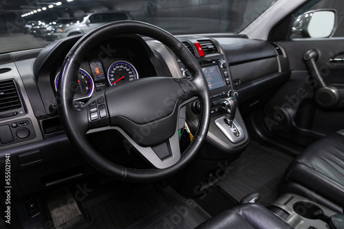 car Interior - steering wheel, shift lever and dashboard, climate control, speedometer, display on white isolated background.