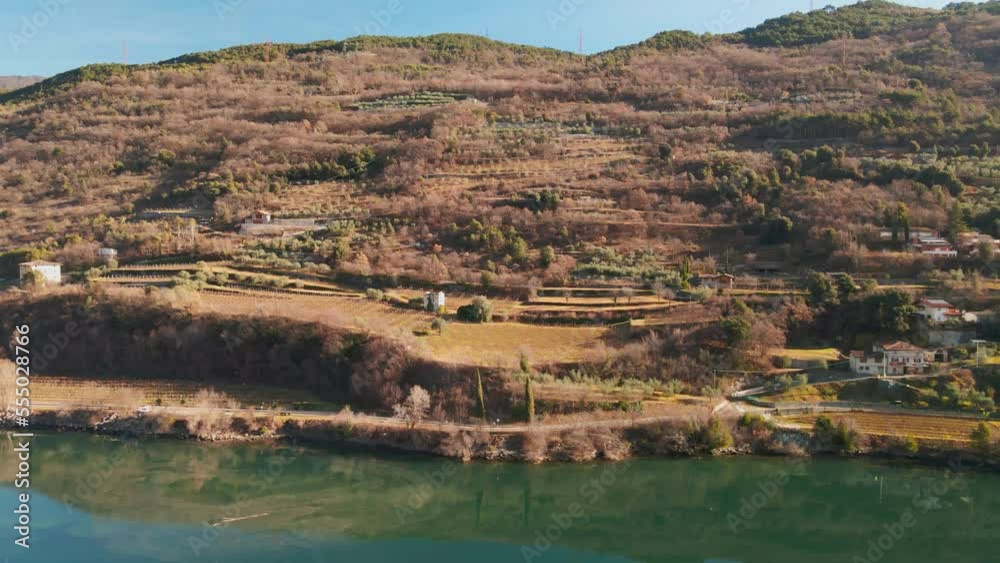 Cavedine Lakeshore With Vineyards And Autumnal Tree Forest During Sunny Day In Trentino, Italy. Aerial Drone Shot Cavedine Lakeshore With Vineyards And Autumnal Tree Forest During Sunny Day In Trentino, Italy. Aerial Drone Shot