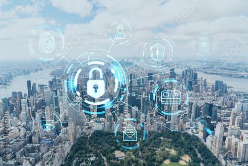 Aerial panoramic helicopter city view of Midtown Manhattan neighborhoods and Central Park, New York, USA. The concept of cyber security to protect confidential information, padlock hologram