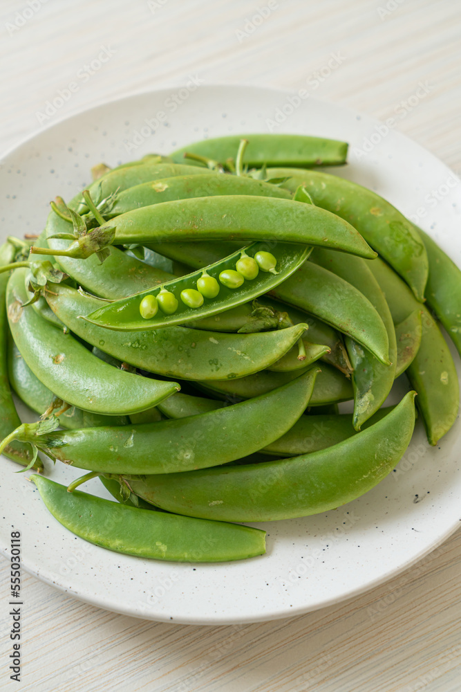 fresh sweet green peas on plate fresh sweet green peas on plate