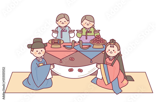 The bride and groom at a traditional Korean wedding reception. Parents celebrate by throwing jujubes.