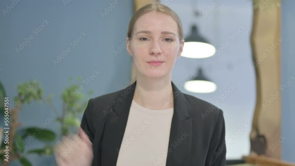 Portrait of Businesswoman showing Thumbs Down Portrait of Businesswoman showing Thumbs Down