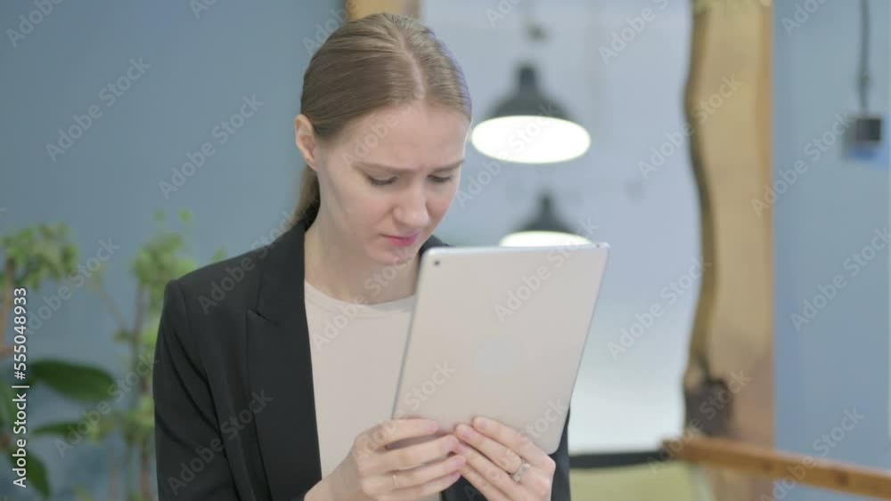 Shocked Businesswoman Reacting to Loss on Digital Tablet Shocked Businesswoman Reacting to Loss on Digital Tablet