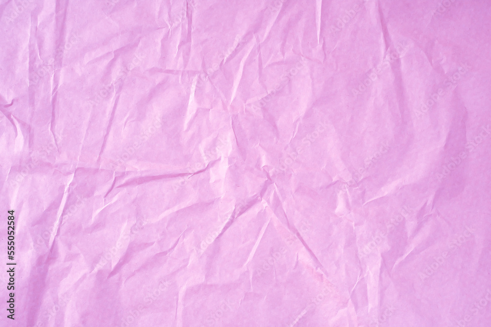 Crumpled pink paper as a background.