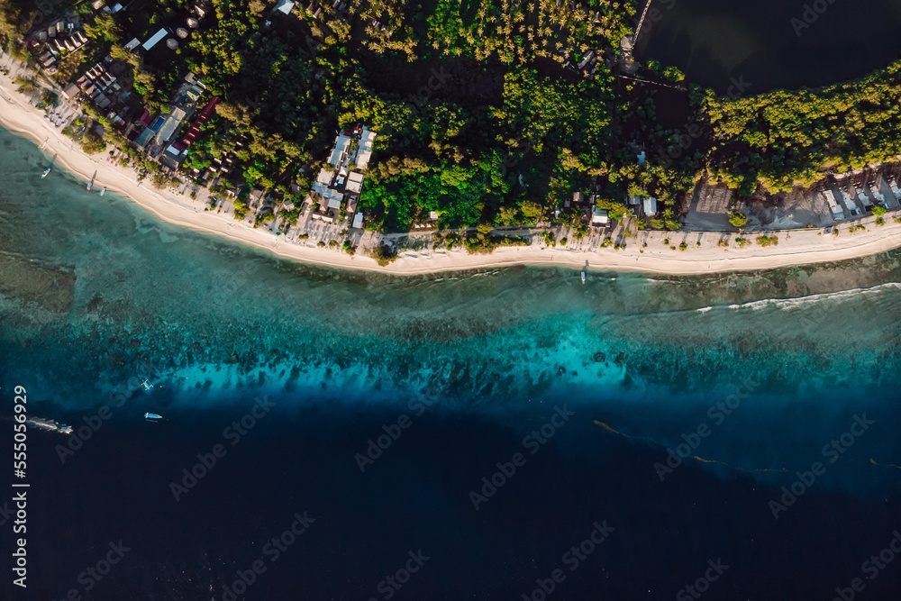 Tropical beach and ocean with boats, aerial view. Tropical Gili islands in Indonesia