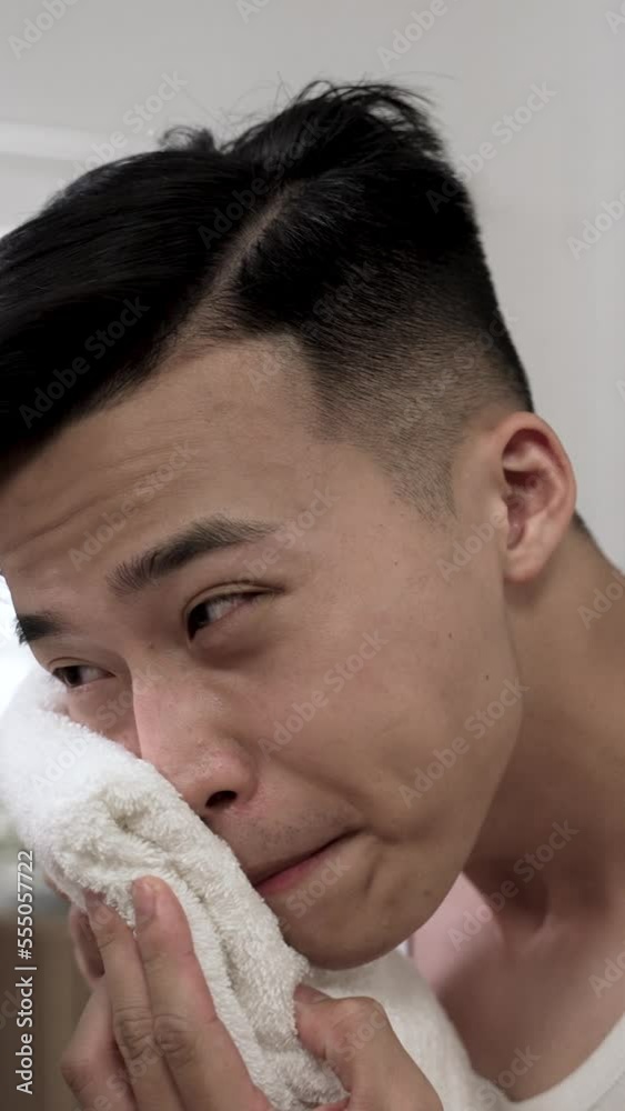 Vertical Video: attractive asian man in undershirt walking near the ...