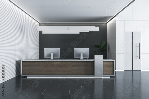 Light wooden and concrete office reception interior with desk and computer monitors. Hotel lobby and waiting area concept. 3D Rendering.
