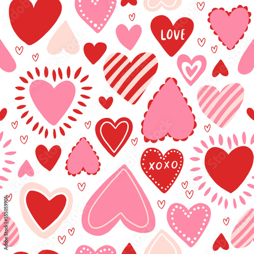 Vector seamless pattern with red and pink hearts. Freehand doodle drawing for valentines day. Can be used on packaging paper, fabric, background for different images, etc.