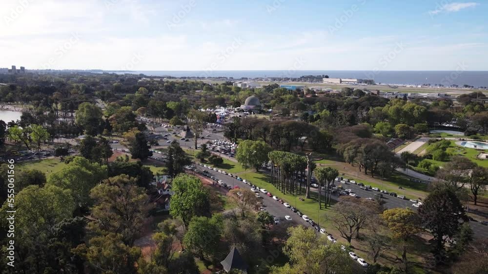 Drone rising above the trees in Palermo woods revealing public gardens and River Plate, Buenos Aires Drone rising above the trees in Palermo woods revealing public gardens and River Plate, Buenos Aires