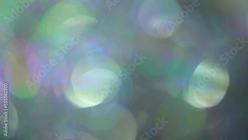 Light Leaks Bokeh Overflow Transition With Fading. Abstract moving defocus. Beautiful round multicolor bokeh shimmers and shimmers. Backdrop, overlay or transition for composing your footage.