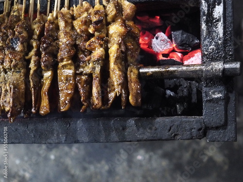 Sate Ayam, Traditional food from Indonesia. It was grilled with charcoal. Eat with peanut sauce. (ID: 555063708)