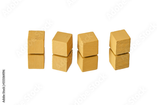 Wooden cubes on a white background. Four identical cubes lie  stand in a row together and separately  directly and at an angle. Place for text