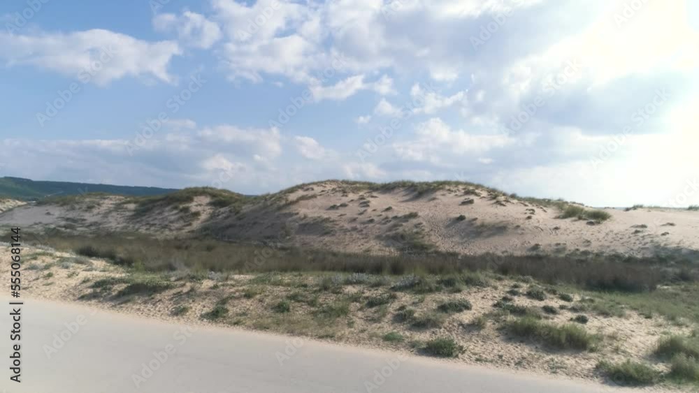 Fast aerial view flying over the beach and sand dunes in Los Canos de Meca Spain Fast aerial view flying over the beach and sand dunes in Los Canos de Meca Spain