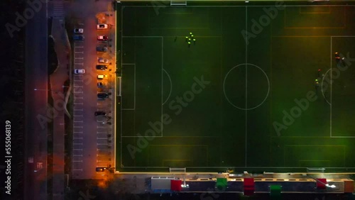 Straight down shot of a football field in the dark with lights sliding right in Santa Ponsa, Mallorca, Spain. photo