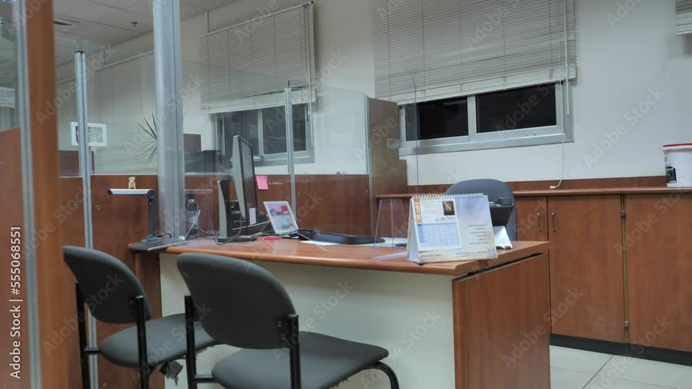 Turning off light in empty bank office at the end of shift Turning off light in empty bank office at the end of shift