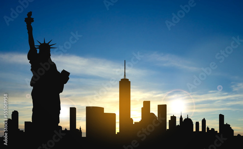 Silhouette of the Statue of Liberty over the scene of New york cityscape on a sunset. EPS10 vector