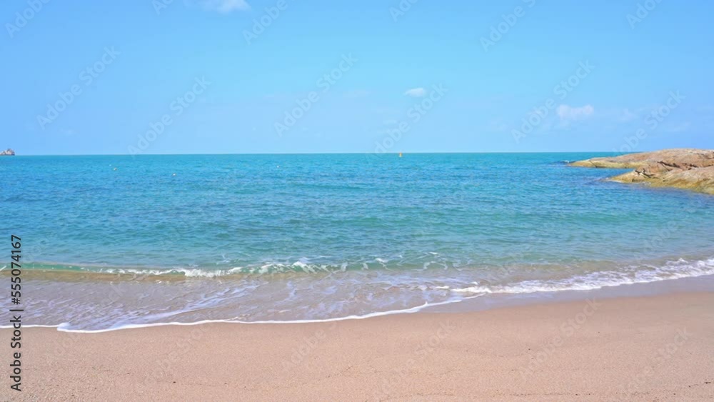 Slow Motion of Tropical Sea Waves Breaking on Sandy Shore and Beach