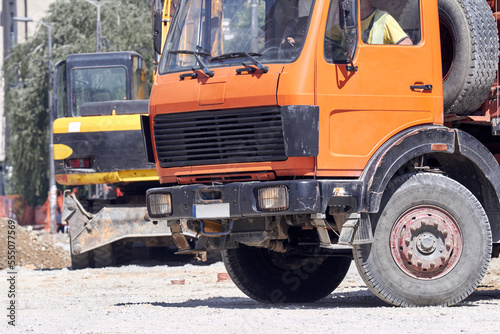 Heavy construction machines and truck outdoors for public place reconstruction.