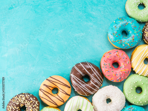 donuts on blue background , copy space, top view