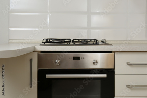 New gas stove and oven in stylish kitchen