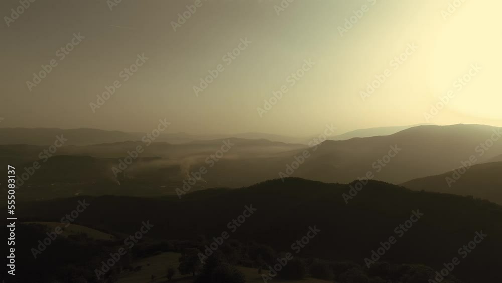 Cinematic aerial shot of an endless mountain and forest landscape. Flight over hills forest in Mountain at sunset. Cinematic aerial shot of an endless mountain and forest landscape. Flight over hills forest in Mountain at sunset.