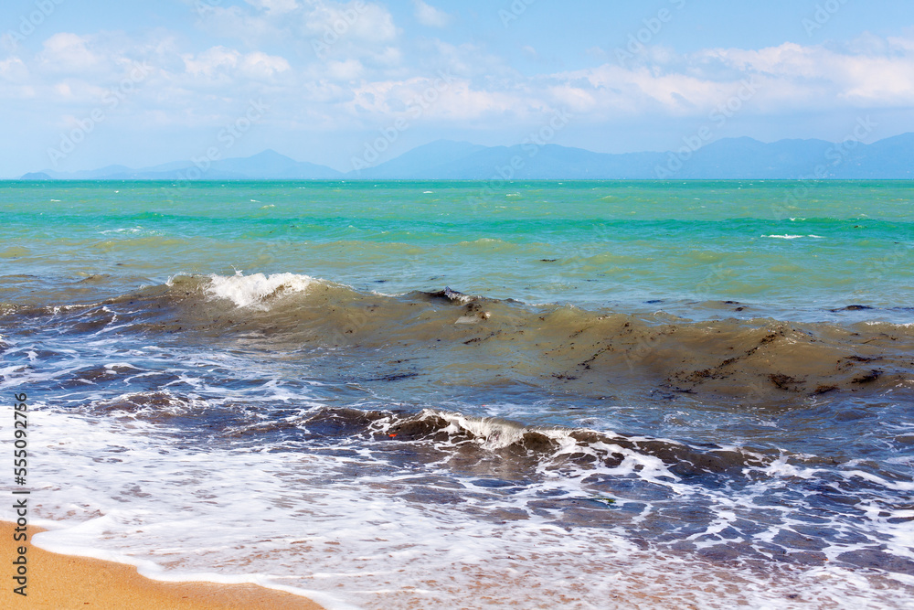 Fototapeta premium Garbage in the sea, dirty ocean water, rubbish, plastic bags, glass bottle, metal can, trash, refuse, litter on sand beach, environmental pollution, ecological problem, waste recycling, global warming