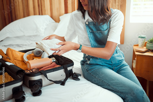 Fotografi Travel, suitcase and woman packing in bedroom preparing for vacation, holiday or trip
