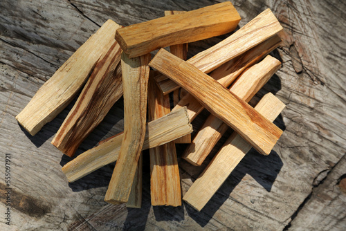 Palo santo sticks on wooden table, top view