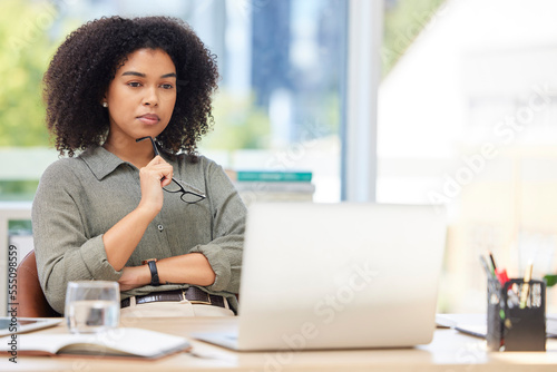 Business laptop, thinking and black woman in office trying to solve problem. Idea, focus and female employee from South Africa with computer contemplating solution, pensive or lost in thoughts alone.