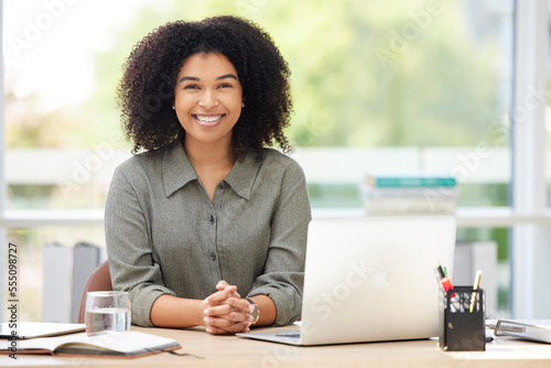 Black woman, business smile and laptop on desk while happy about leadership, success and growth of startup company. Portrait of female entrepreneur with pride for development and service as leader