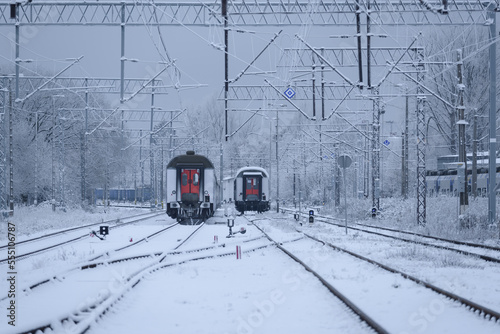 SNOWY WINTER ON THE RAILWAY - Wagons of a passenger train on a snow covered railway siding