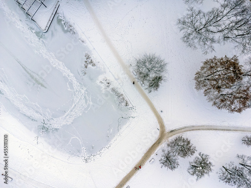 Obraz na płótnie Aerial view. Winter landscape, snow, frost, white everywhere. Path, trees , white powder. w salonie