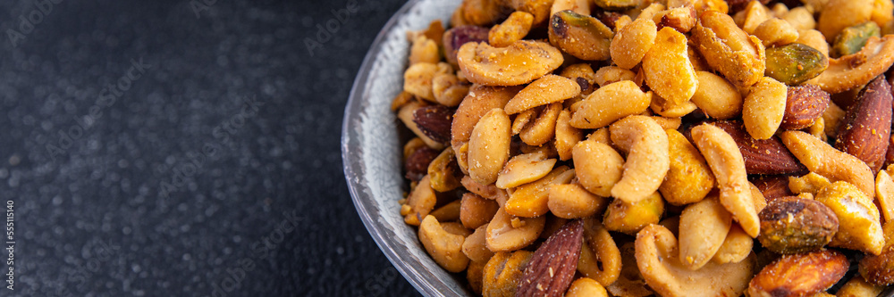 nut mix almond, cashew, pistachio, peanut fresh nuts meal food snack on the table copy space food background rustic top view nut mix almond, cashew, pistachio, peanut fresh nuts meal food snack on the table copy space food background rustic top view