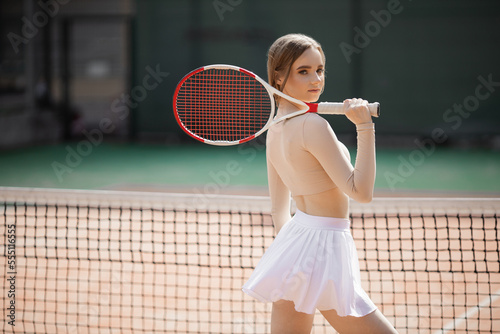 portrait of a beautiful young woman playing tennis  © Alexandr