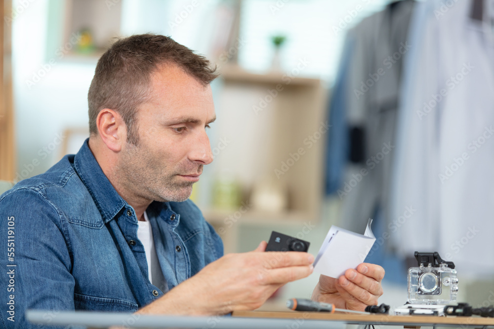 a man is fixing camera a man is fixing camera