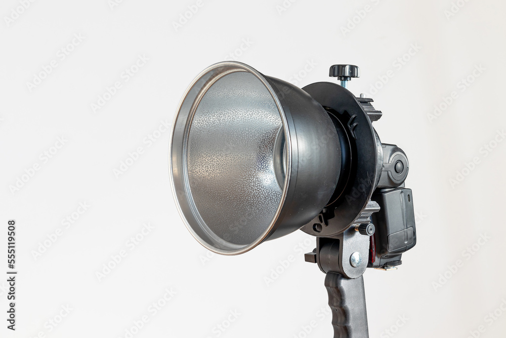 A reflector for photographing complete with a flash on a white background A reflector for photographing complete with a flash on a white background