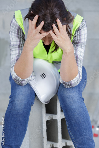 an exhausted female engineer at work photo