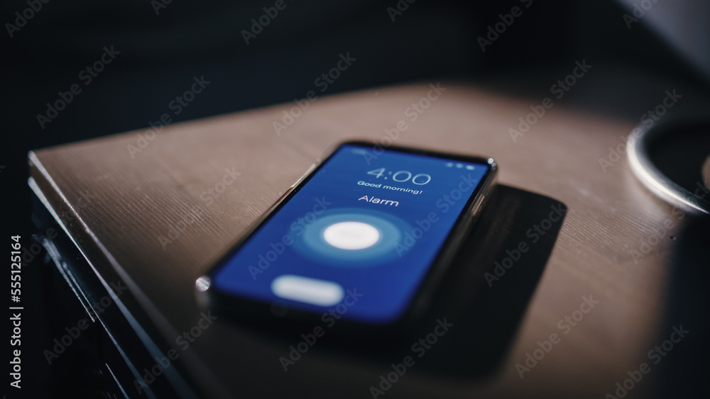 Smartphone Alarm Clock App Rings for Wake up, Screen Shows "Good Morning"  and Time of Four in the Morning. Close-up Focus on Mobile Phone Ringing on  a Bedside Nightstand in Apartment Photos