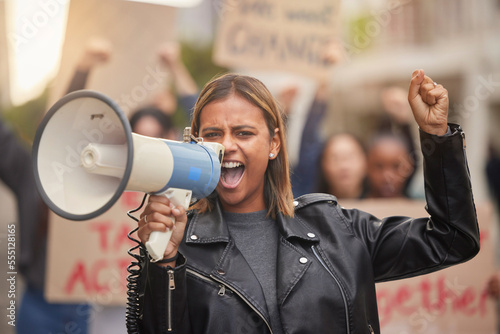 Fotografie Justice, megaphone and shouting with woman in protest for equality, freedom and support for change