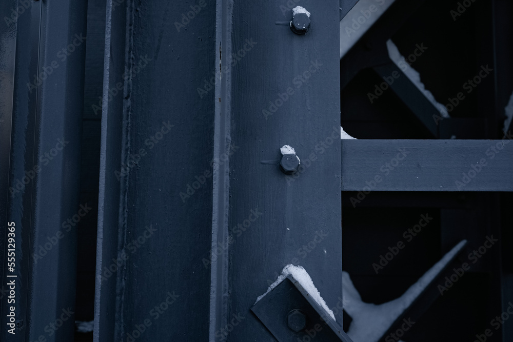 Metal ladder. A close-up photo of a technological metal black structure. Abstract background image on the theme of modern architecture. mounting, bolt Metal ladder. A close-up photo of a technological metal black structure. Abstract background image on the theme of modern architecture. mounting, bolt