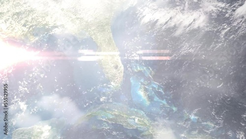 Earth zoom in from outer space to city. Zooming on West Palm Beach, Florida, USA. The animation continues by zoom out through clouds and atmosphere into space. Images from NASA